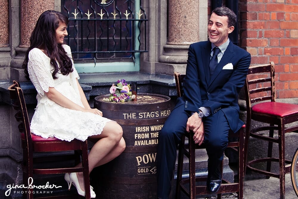 Bride and Groom laughing outside of pub