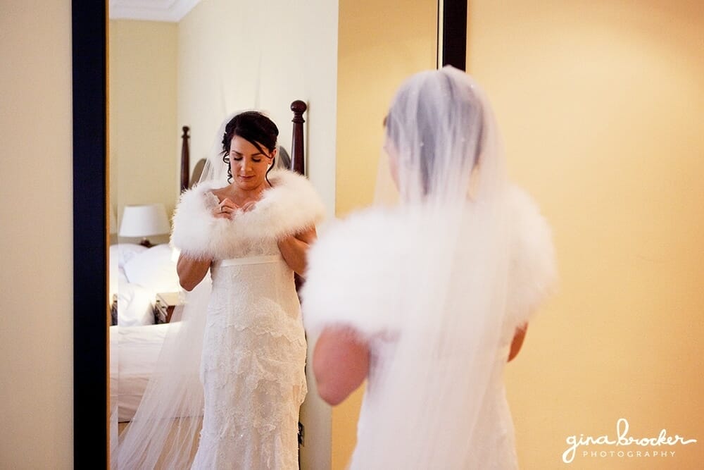Bride looking in mirror