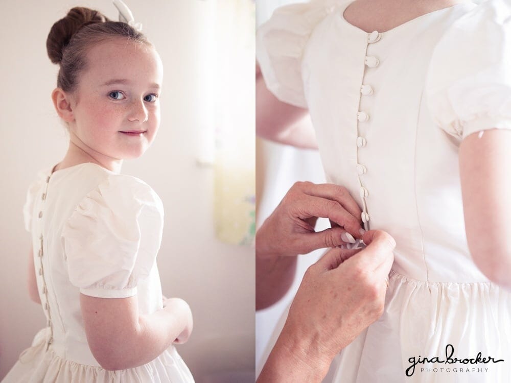 Flower girl in a classic white dress for a winter wedding