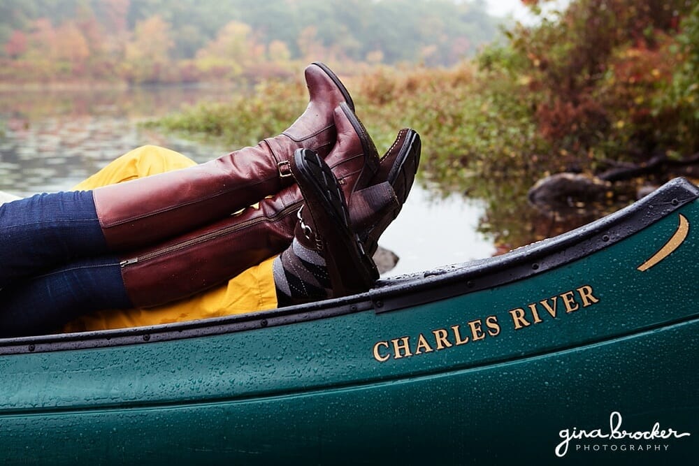 A beautiful detail of a couples shoes as they relax in their canoe during their fall engagement session on the charles river in Boston