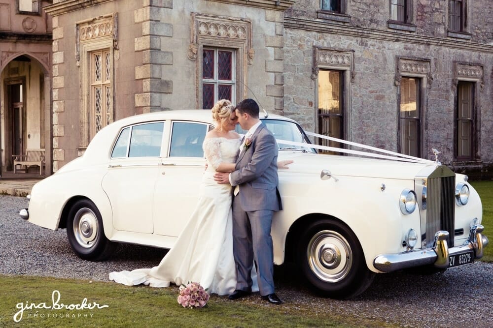 romantic Bride and Groom with wedding car