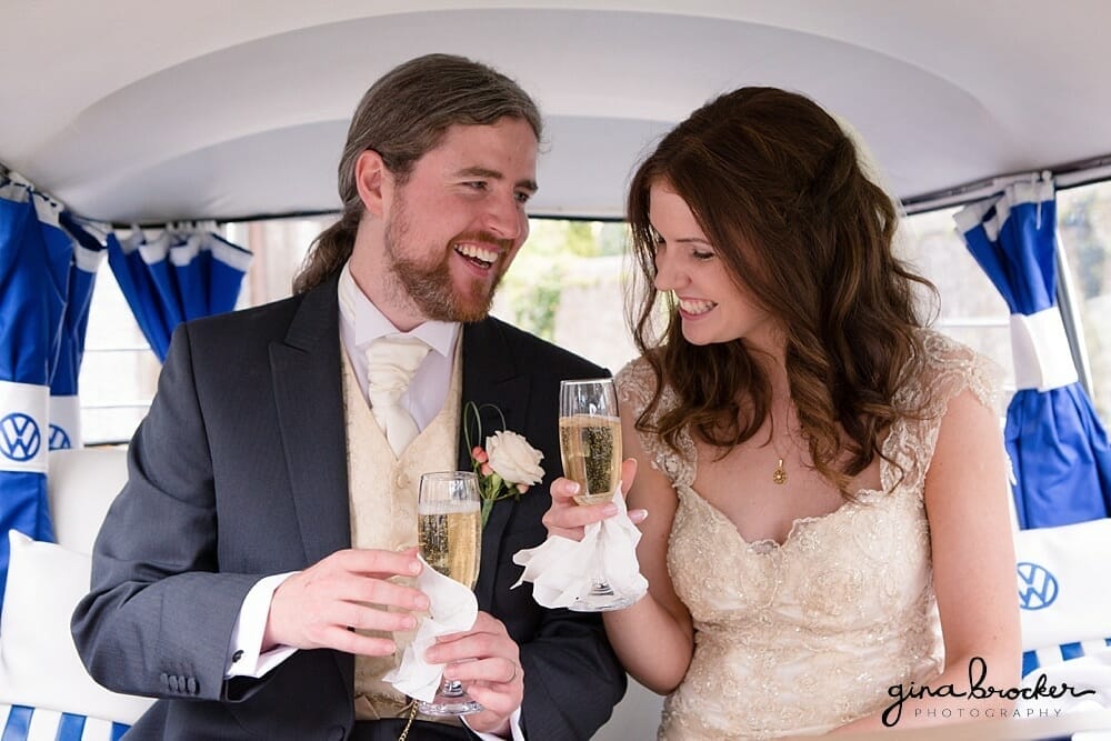 Bride and Groom drink champagne in blue VW Bus