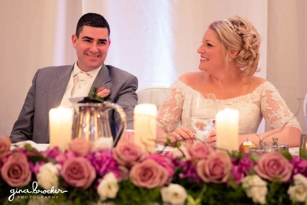 Bride laughs during wedding speeches