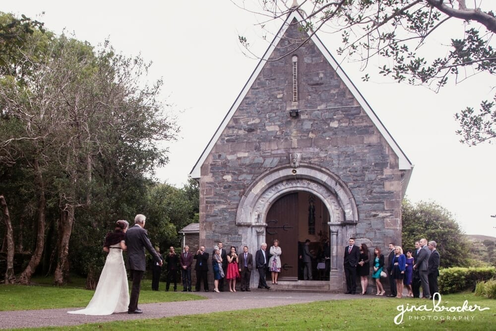 Bride and Grandfather Walking into Small Scenic Church