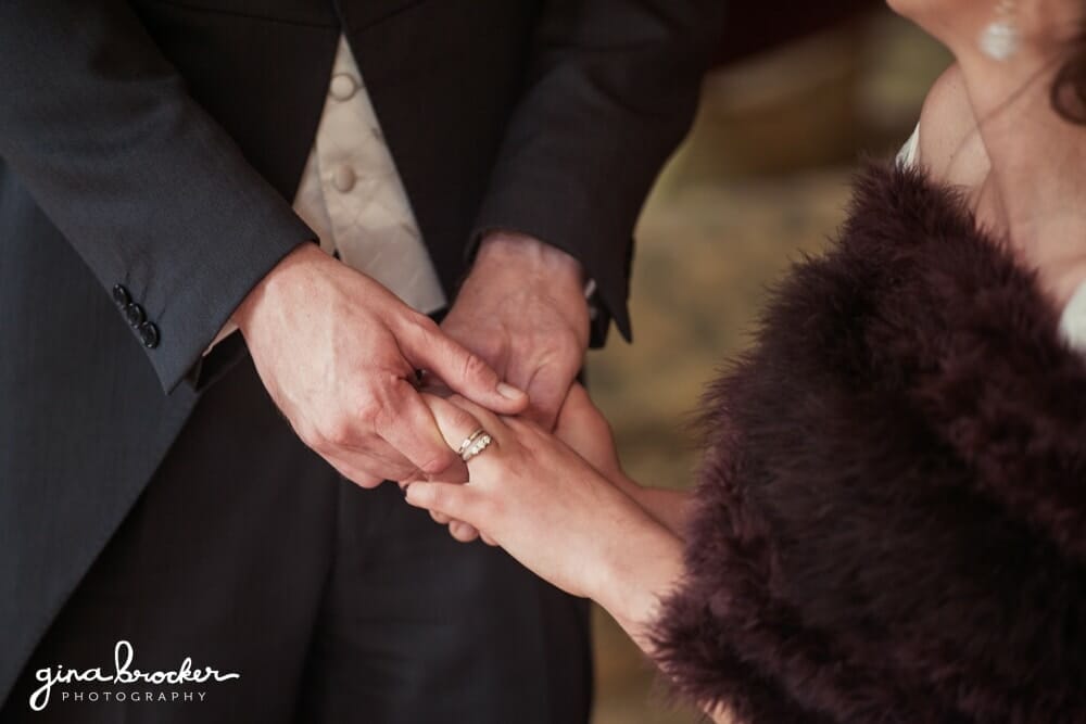 Groom Puts Wedding Ring on Bride