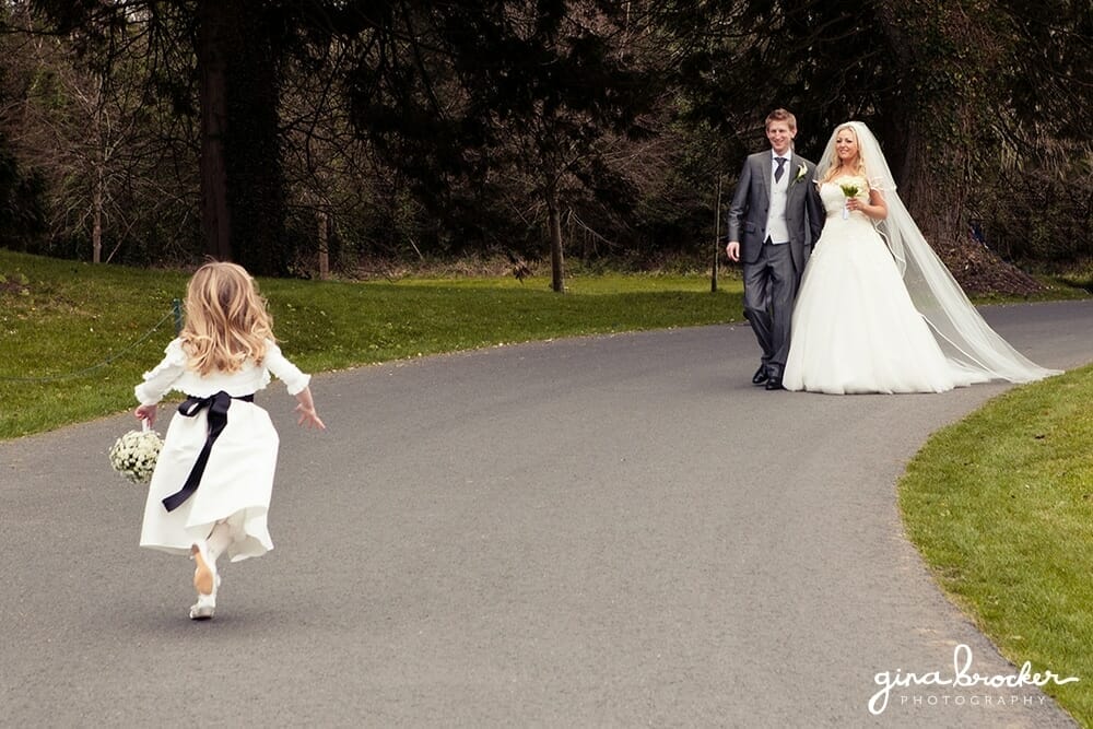 bride and groom with daughter bride and groom walking with daughter