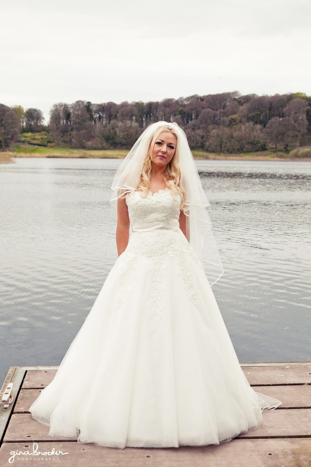 classic bride beside lake classic bride beside lake