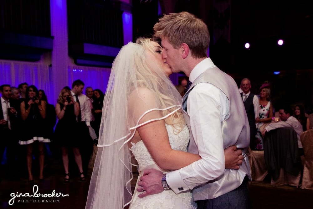 bride and groom kiss during their first dance