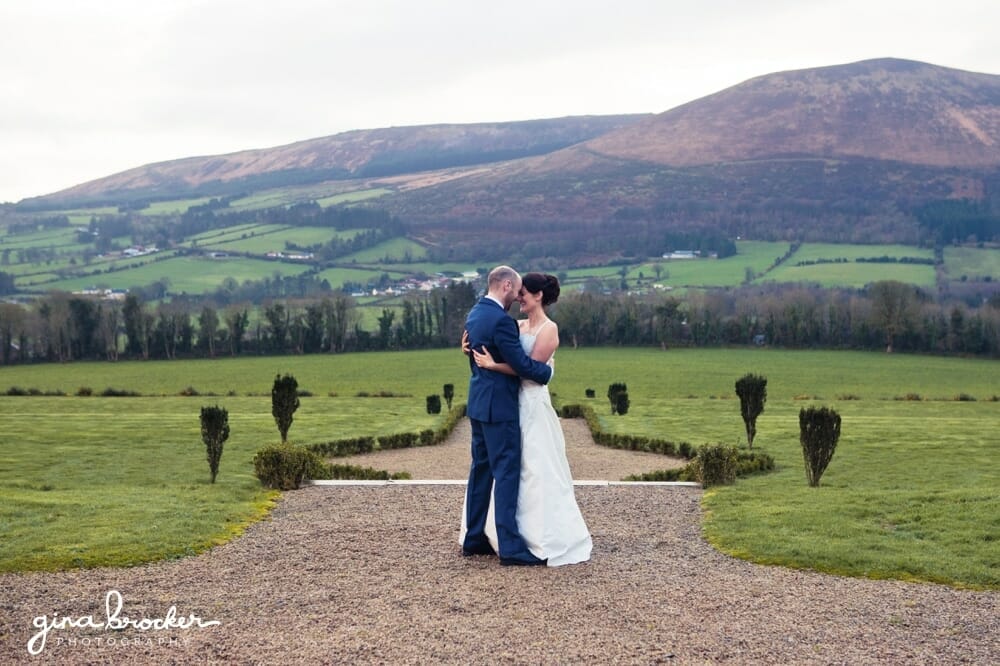 A beautiful portrait of a bride and groom hugging during their majestic wedding in New England