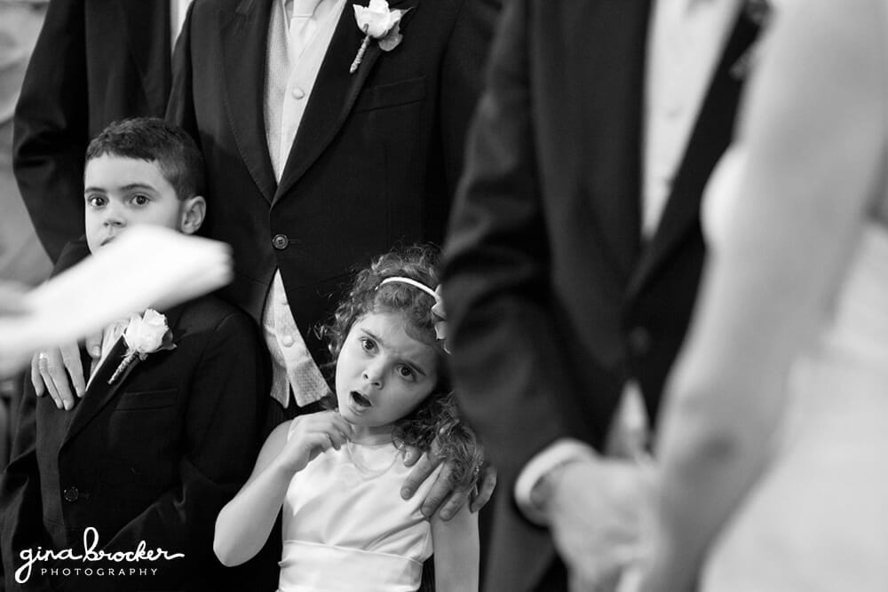 A flower girl yawns during a wedding ceremony in Boston, Massachusetts
