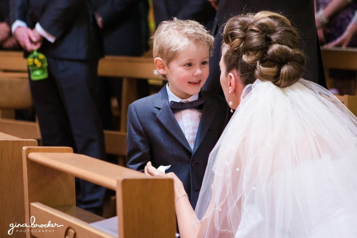 The bride shares a special moment with her son after the wedding vows are said