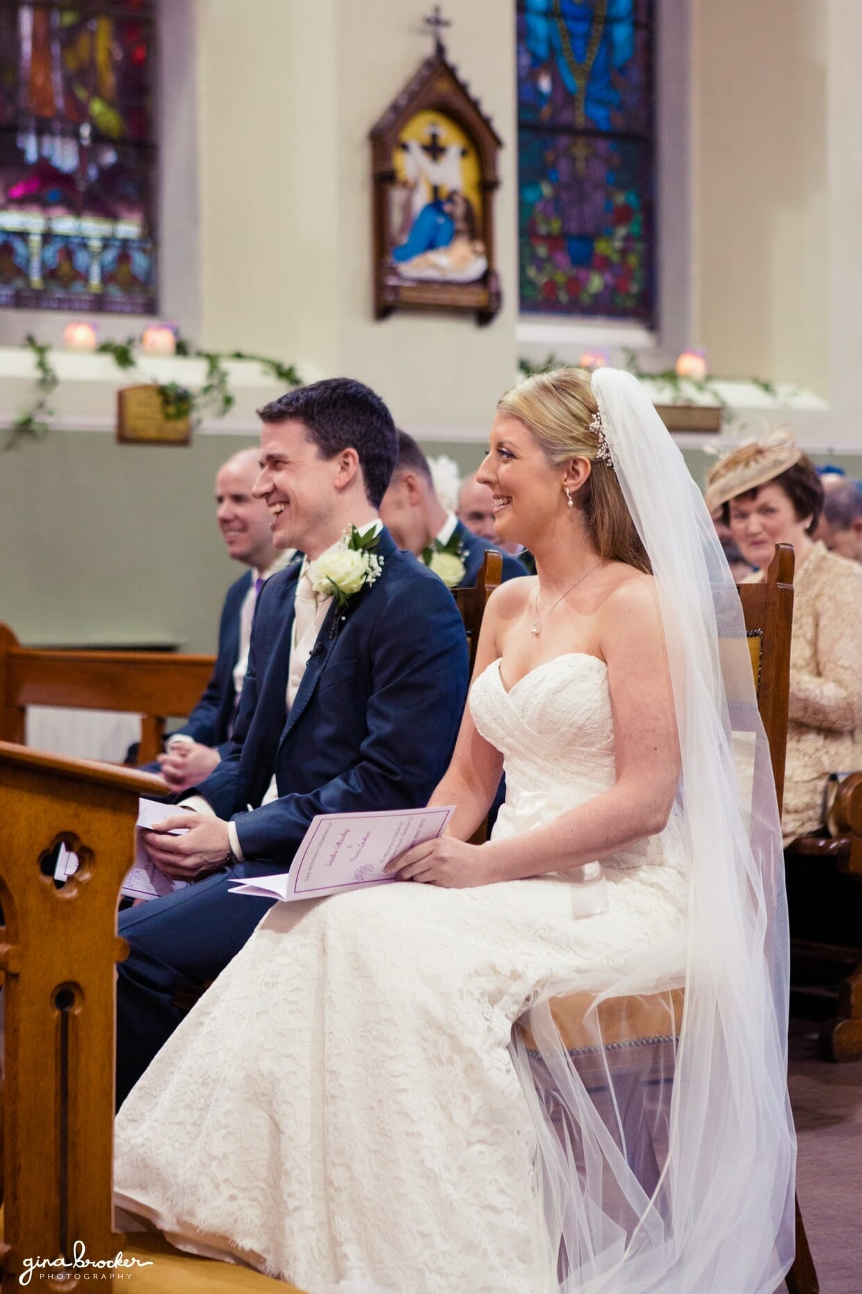 bride-groom-laughing-during-wedding-ceremony The bride and groom share a funny moment during their intimate church wedding