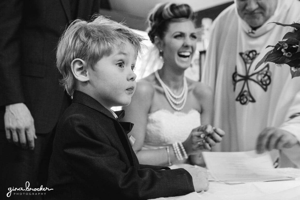 22.ring.bearer.at.ceremony Bride and son sharing a fun moment at the wedding ceremony