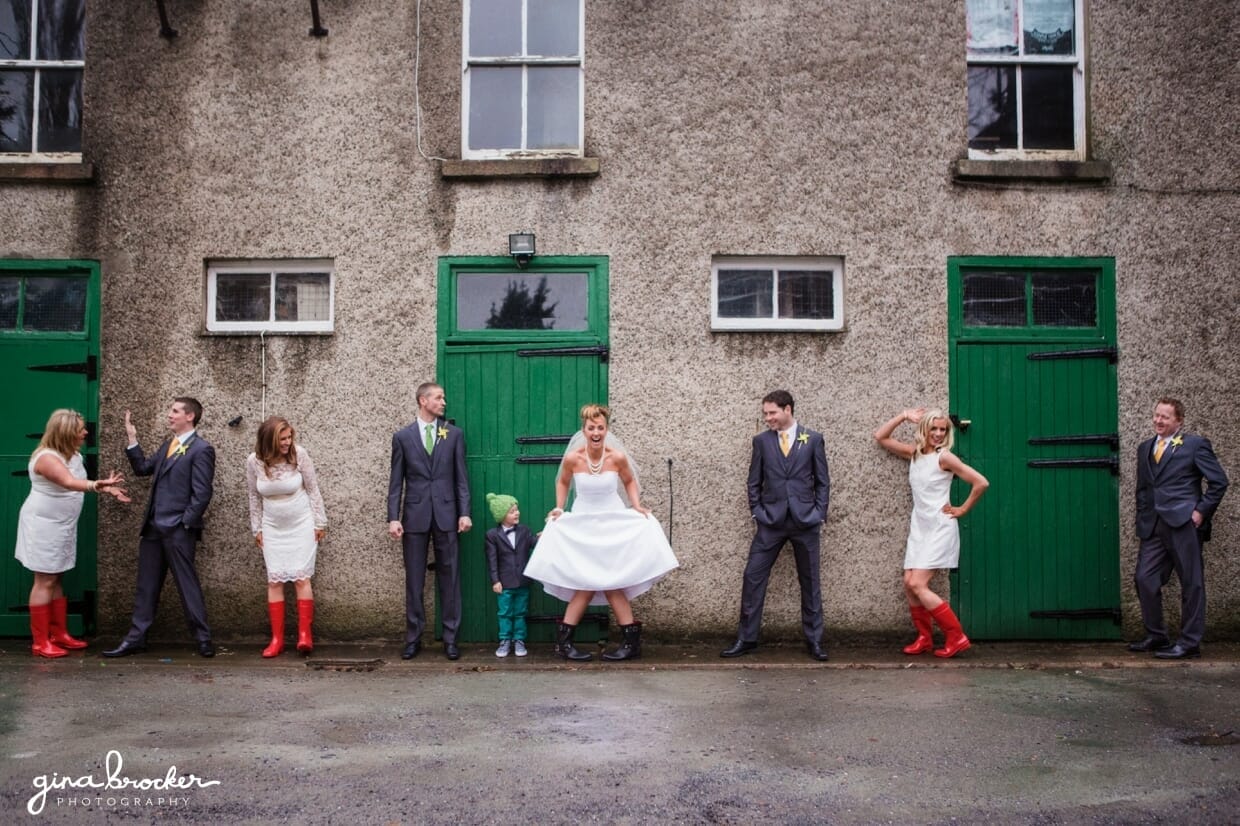 A fun and silly photograph of the wedding party at a retro wedding