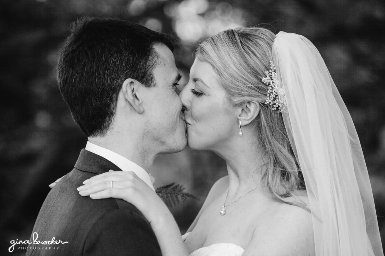 the-kiss The bride and groom share a special and romantic moment during their portrait session in the woods