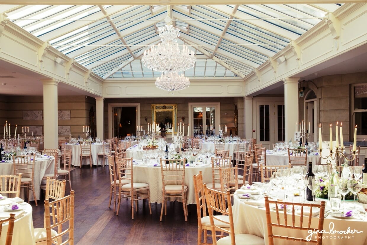 A beautifully decorated classic vintage dining room with chandeliers, teacups and candlesticks