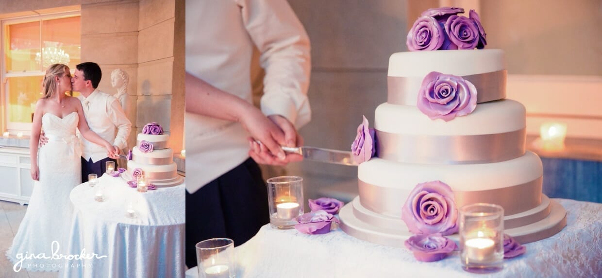 The bride and groom cut their classic wedding cake with silver accents and purple flowers