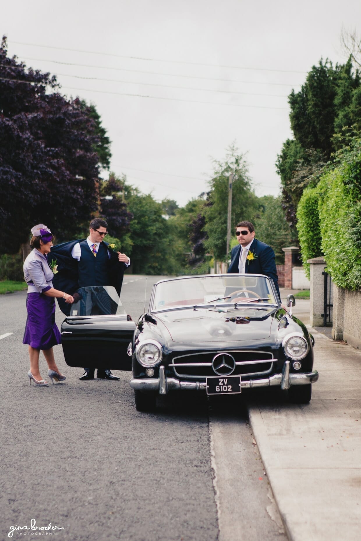 Groom gets into a vintage mercedes benz convertible before leaving for the wedding ceremony