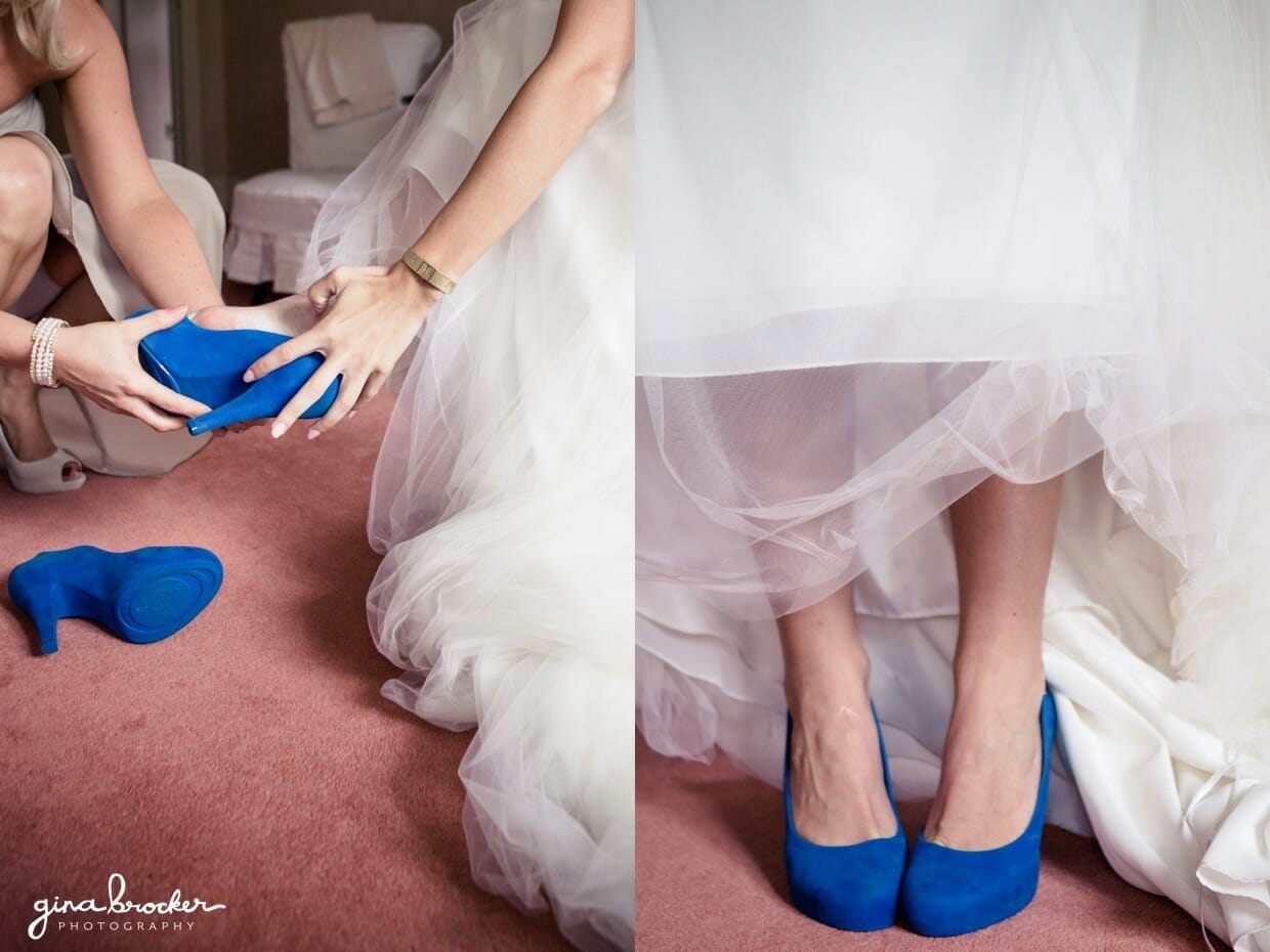 A bride puts on her vivienne westwood wedding shoes as her something blue on the morning of her wedding in Boston, Massachusetts