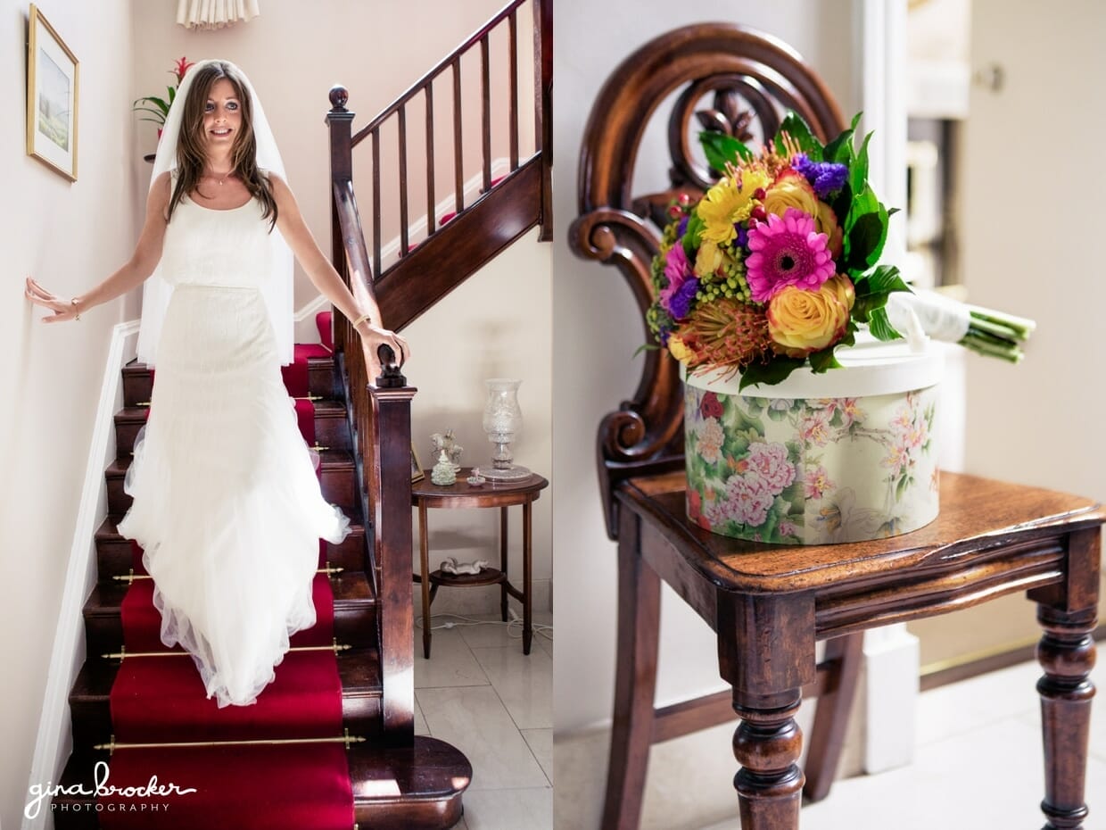 The bride walks down the stairs with her colorful and whimsical bouquet on the morning of her elegant wedding