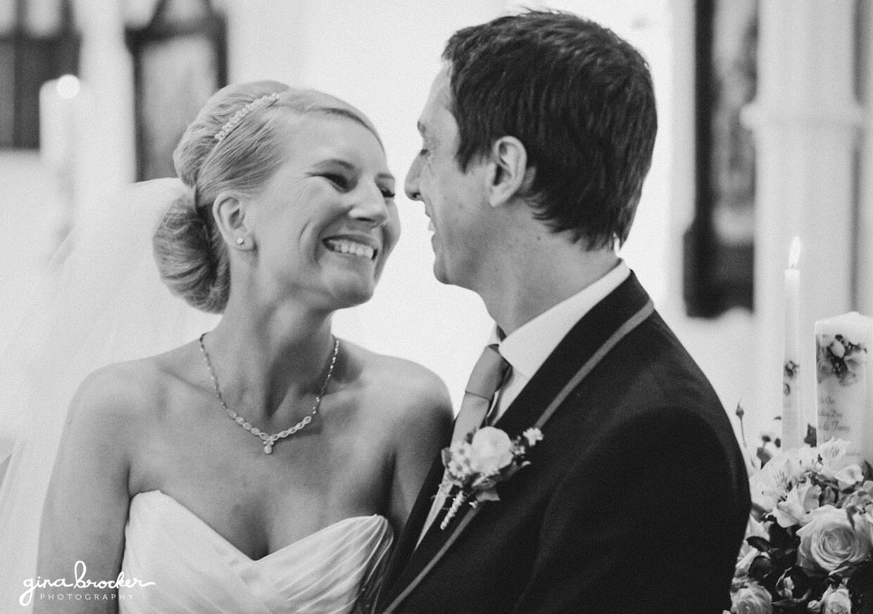 The bride and groom lean in for a kiss as they are pronounced husband and wife