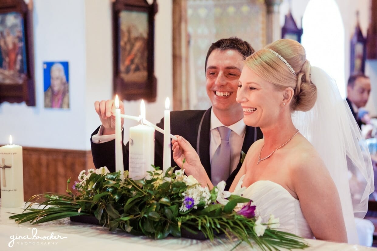 The bride and groom light the unity candle after they say their i dos.