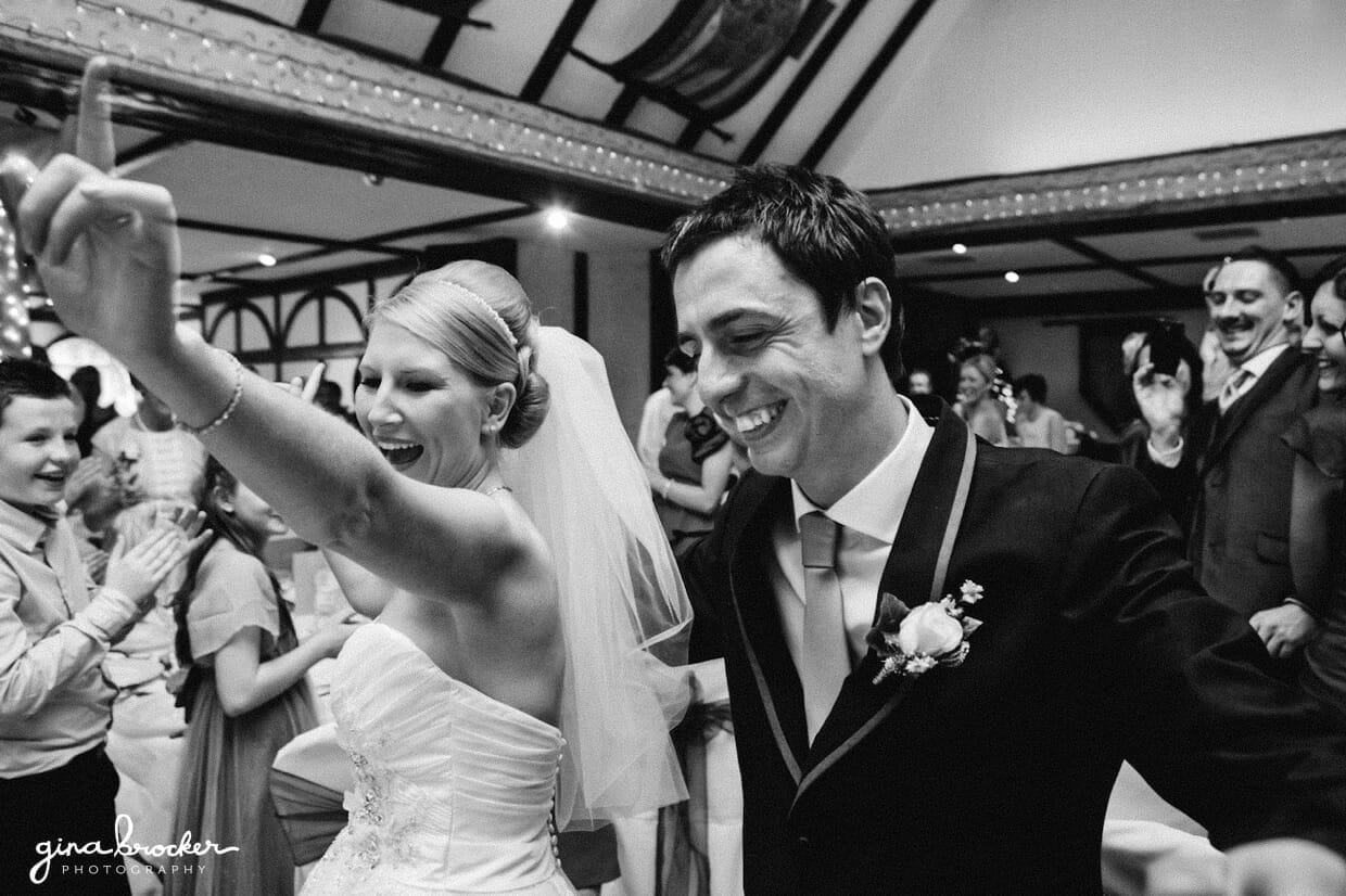 The guest cheer as the bride and groom enter the dance floor for their first dance