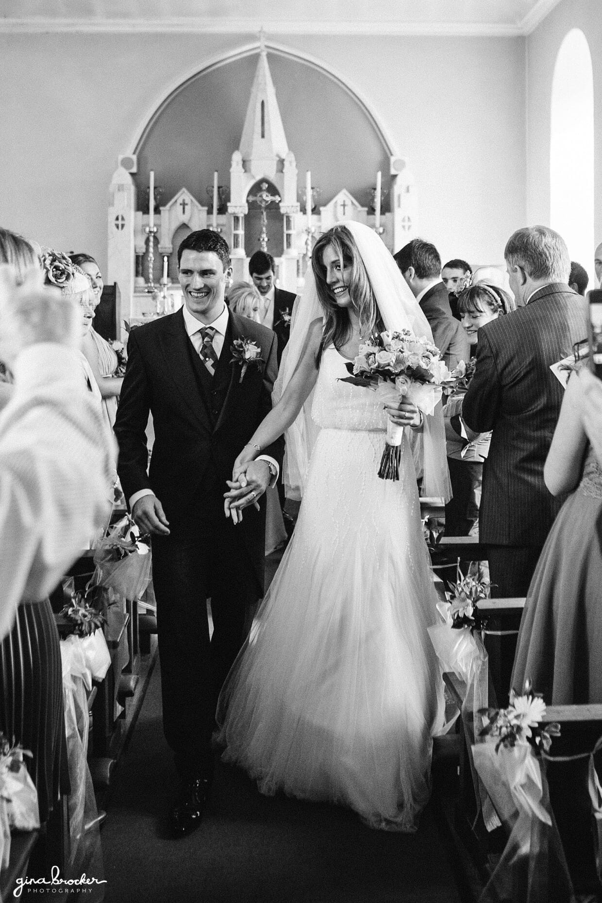 The bride and groom walk down the aisle as husband and wife