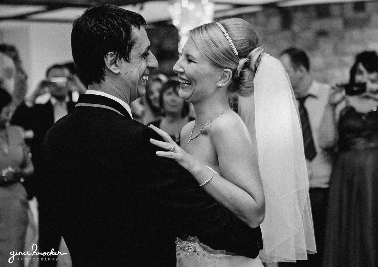 The bride and groom share a sweet first dance at their retro wedding