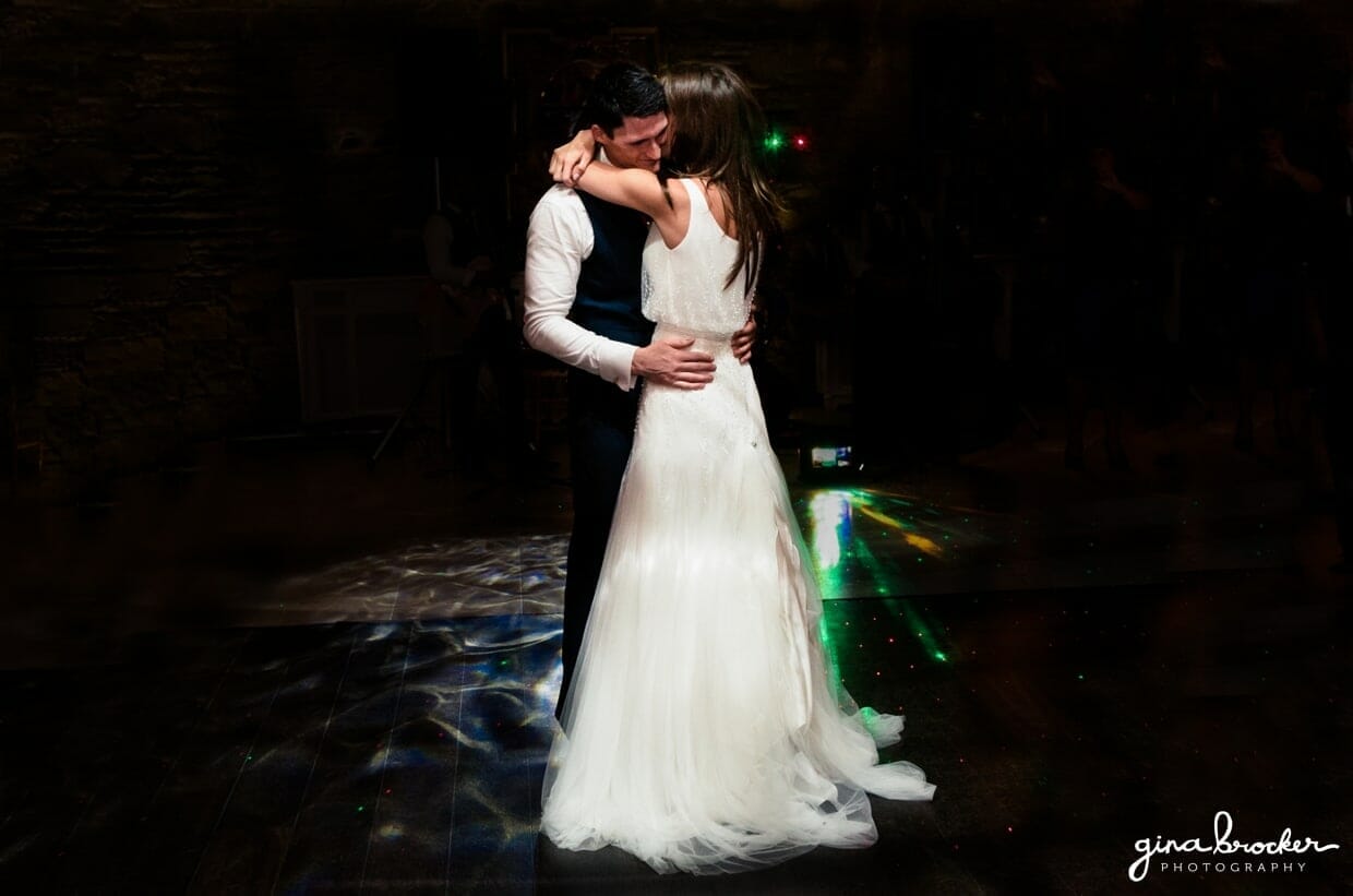 the bride and groom share a romantic first dance