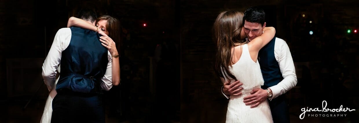 The bride and groom hug during their first dance as husband and wife