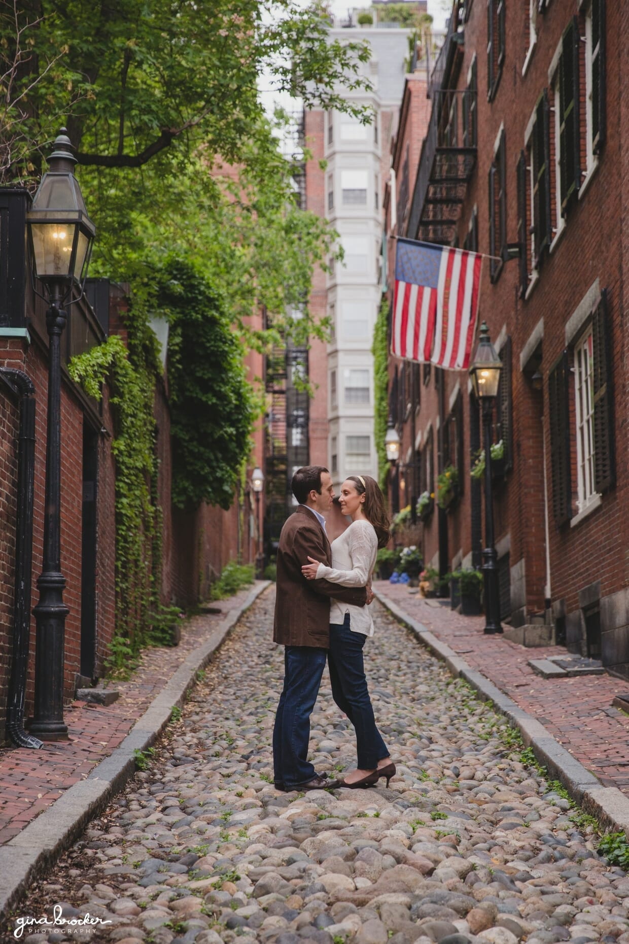 A beautiful portrait of a couple standing on the streets of Beacon Hill during their engagement session