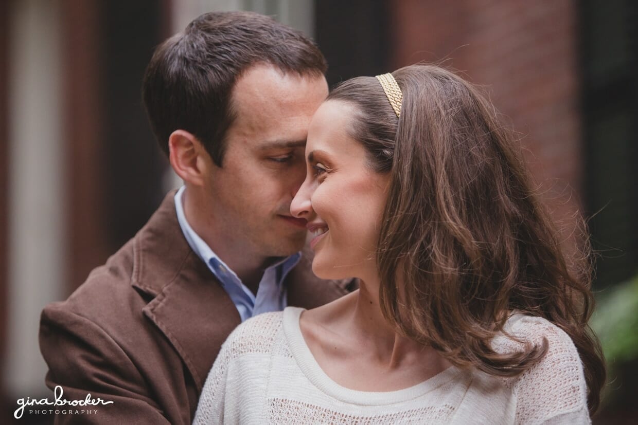 A close up portrait of a couple hugging during their boston engagement session in beacon hill