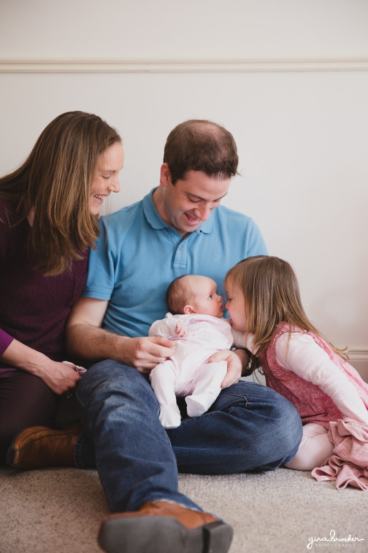 Candid photograph of family during a photo session at their Boston home