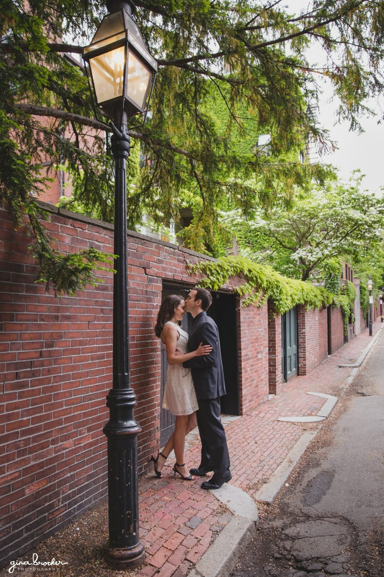A couple share a sweet kiss during their Boston Engagement session in Beacon Hill