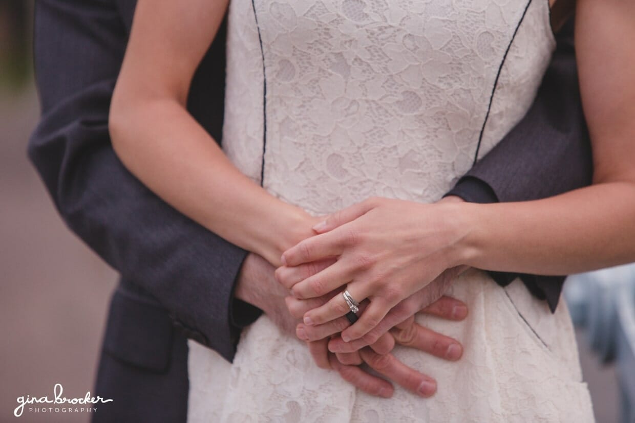 A detailed photograph of a couple cuddling during their engagement session in the Boston Public Gardens