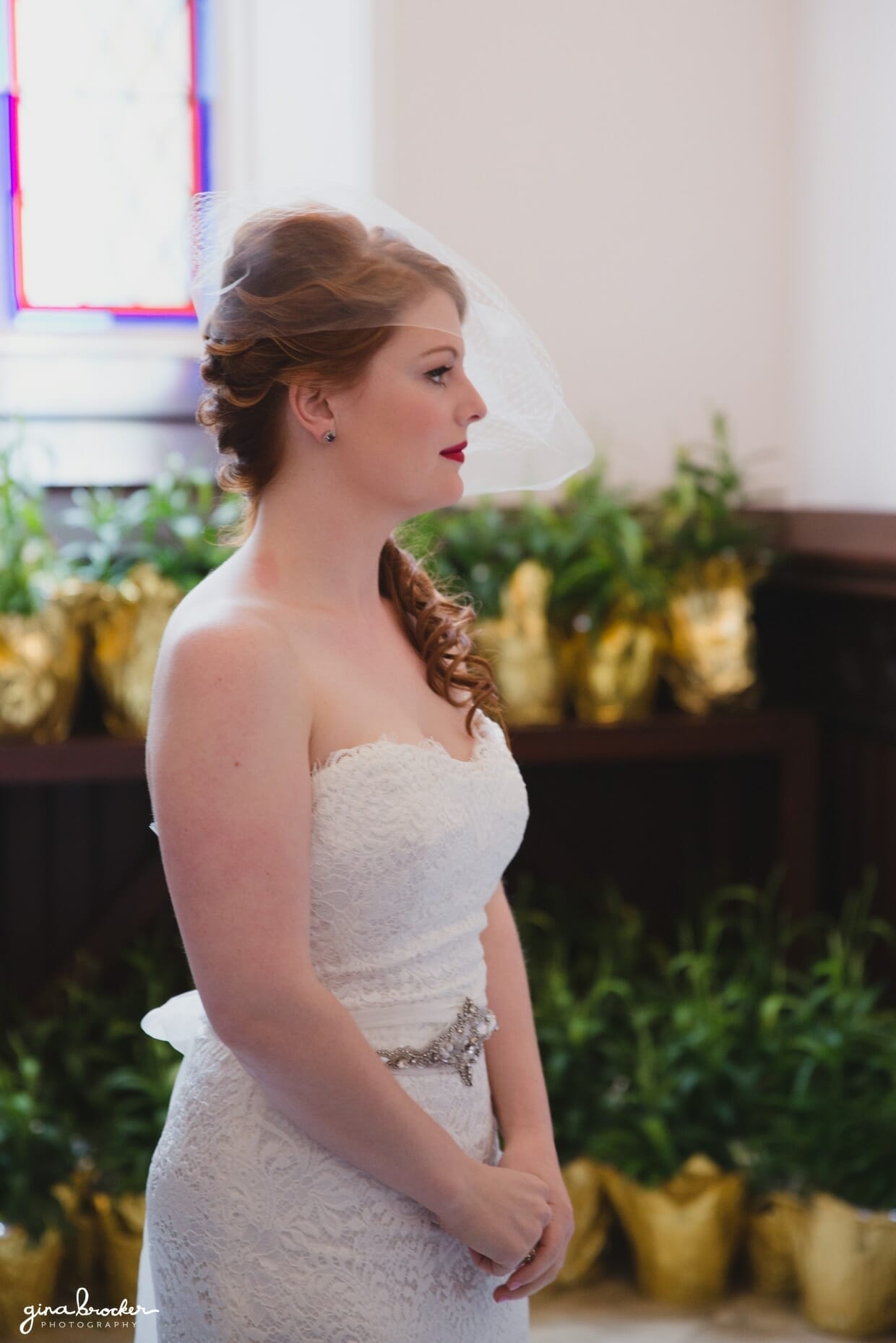 A portrait of a bride in the Sacred Heart of Jesus Church, Cambridge, Massachusetts just before she walks up the aisle