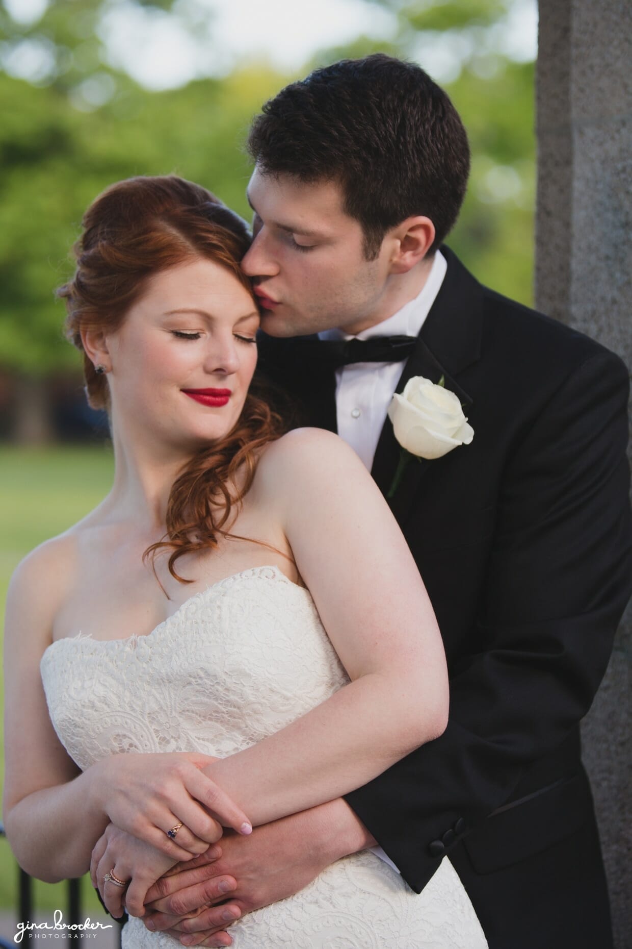 A sweet portrait of a groom kissing his vintage inspired bride at their wedding in Salem, Massachusetts