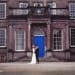 A bride and groom hug during their first look at a vintage inspired wedding in boston massachusetts