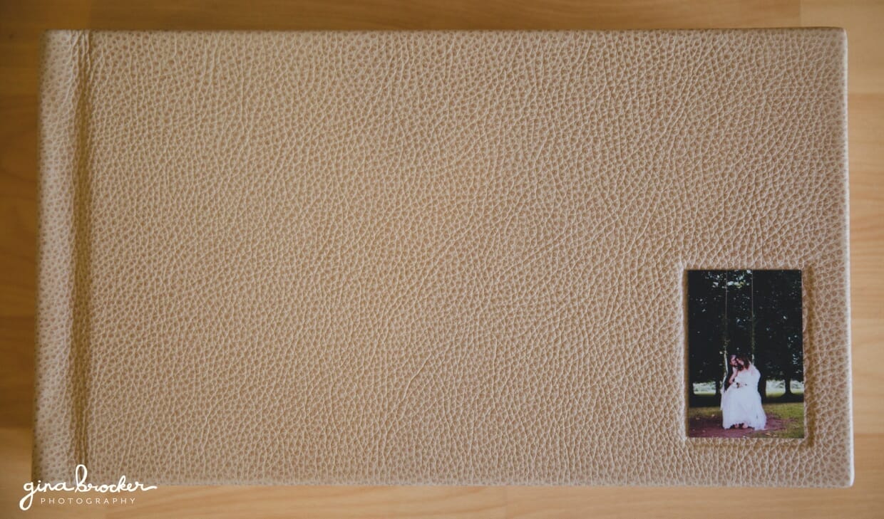 A bespoke wedding album with premium leather cover and custom photo inlay