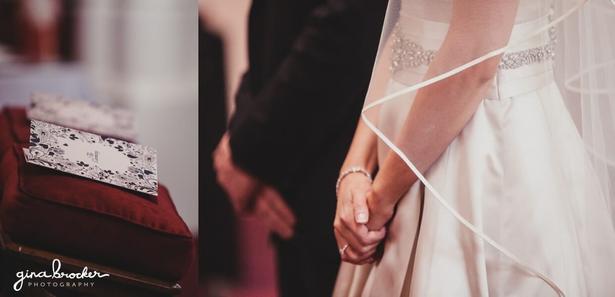 A detail of the bride and grooms hands and wedding programs during their religious wedding ceremony in a church