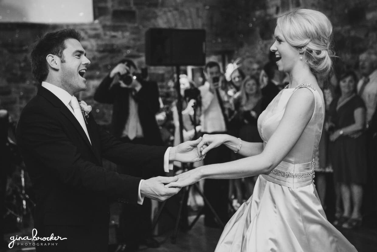 The bride and groom have fun during their first dance as husband and wife