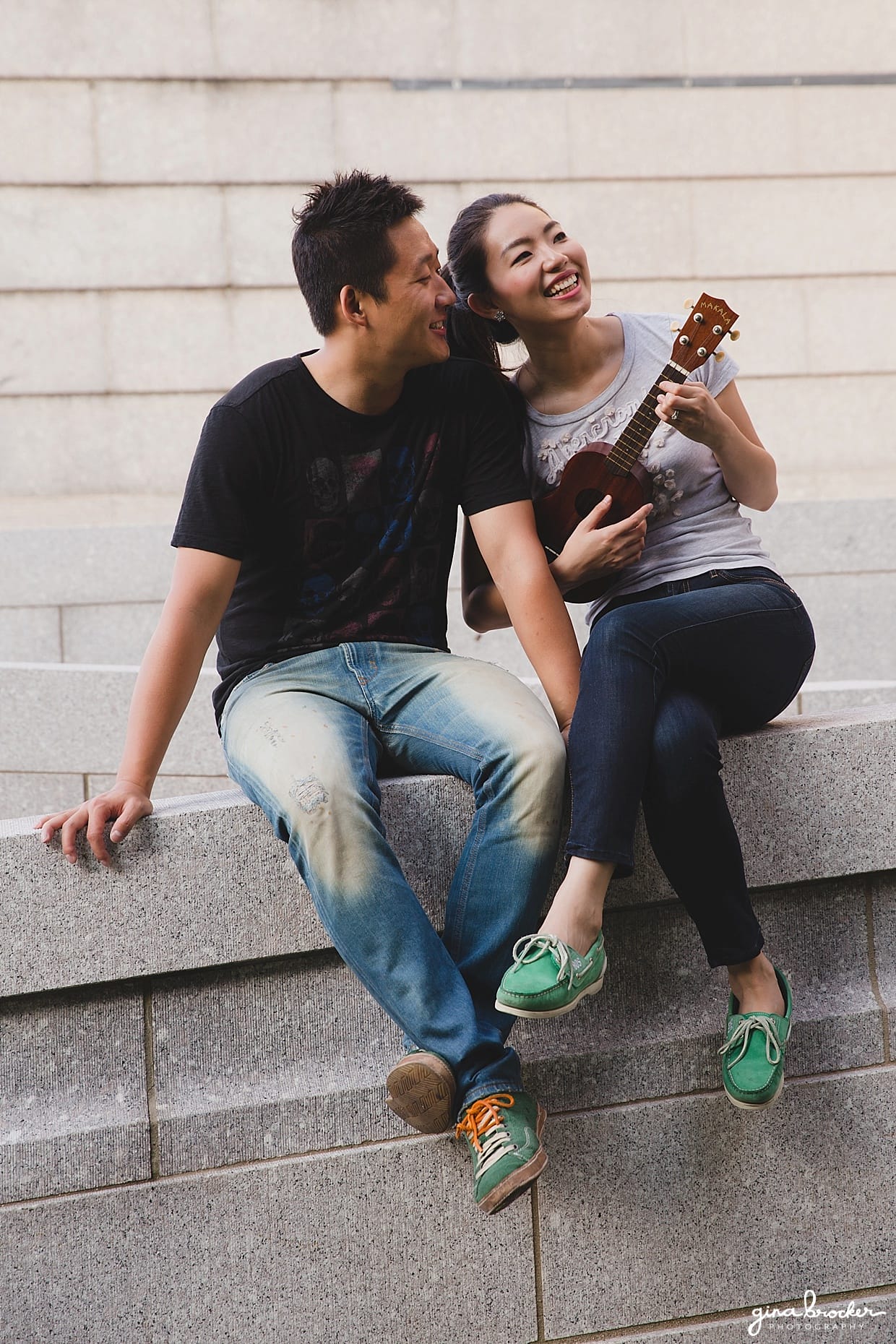 A couple play an ukulele during their engagement at the Boston Museum of Fine Art in Massachusetts