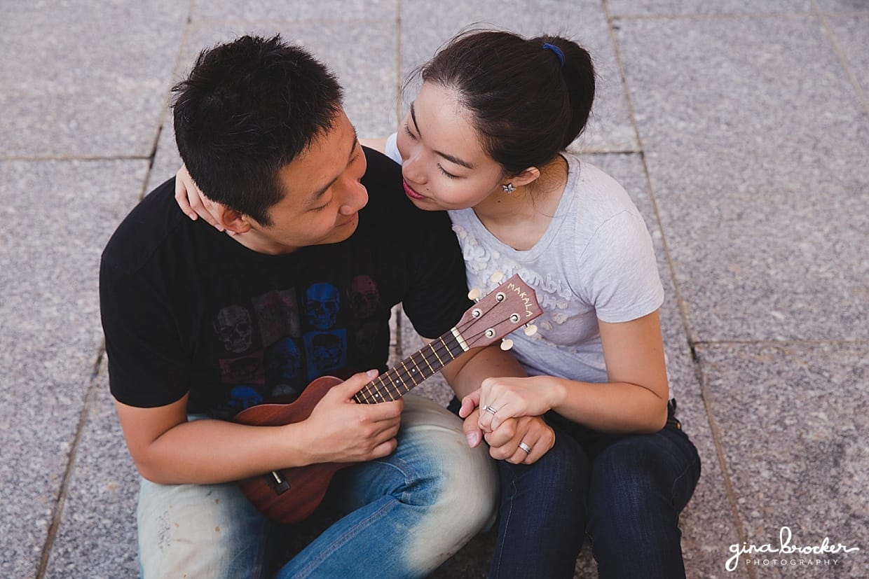 An aerial view of couple playing an ukulele during their engagement at the Boston Museum of Fine Art
