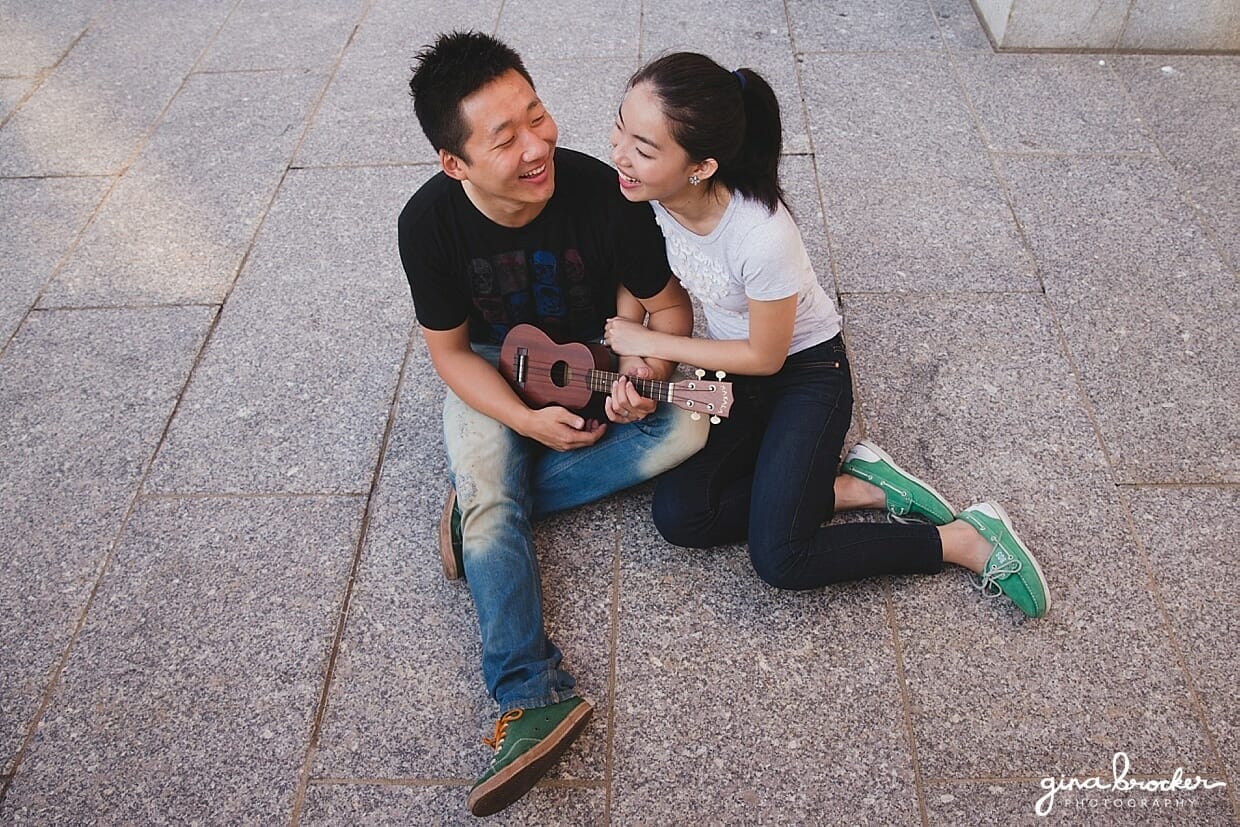 A couple laugh while they play their ukulele during an engagement session at the Boston Museum of Fine Art