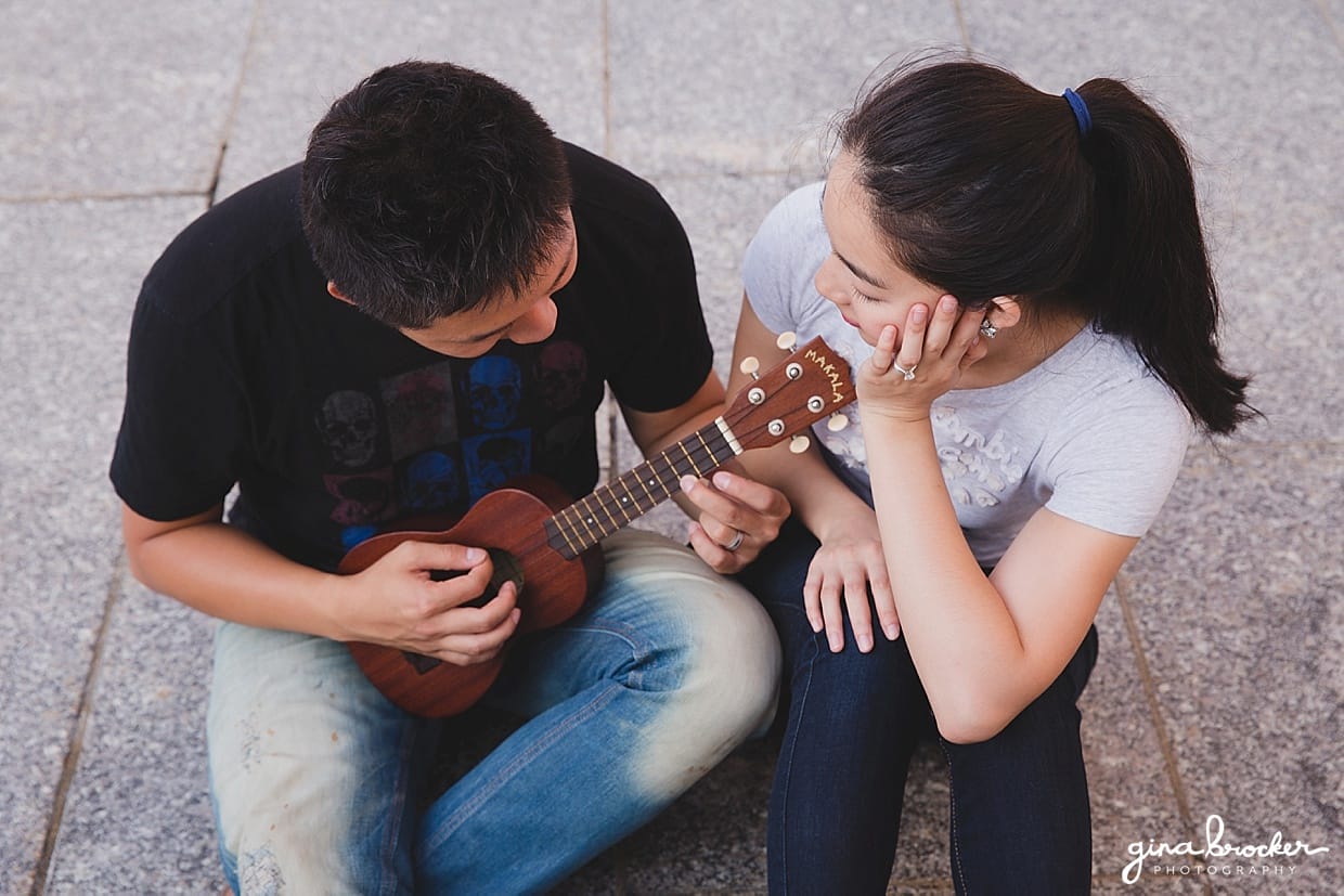 A couple play their ukulele during their music themed engagement session in Boston, Massachusetts