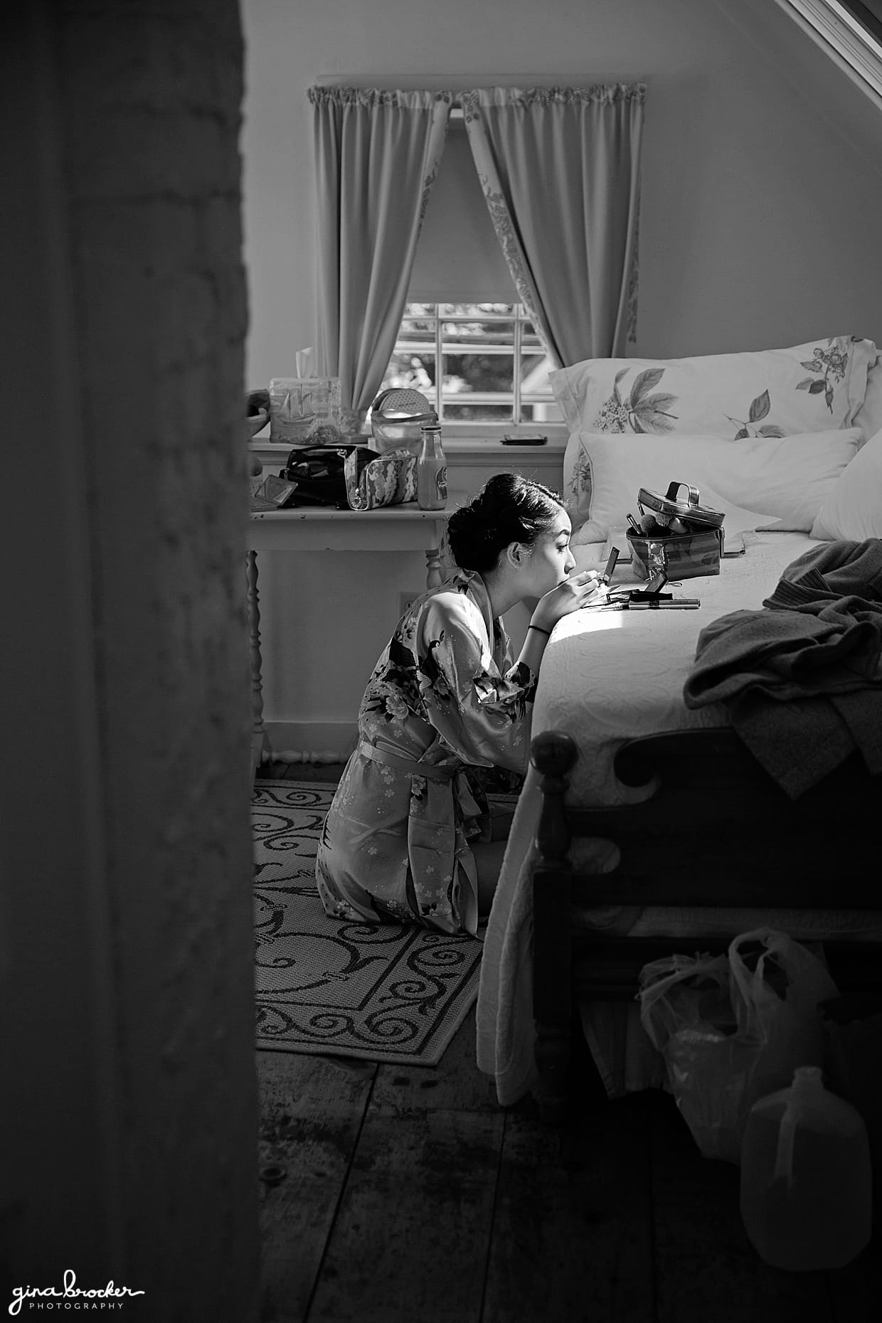 A candid photograph of a bride getting ready on the morning of her wedding in Hammond Castle
