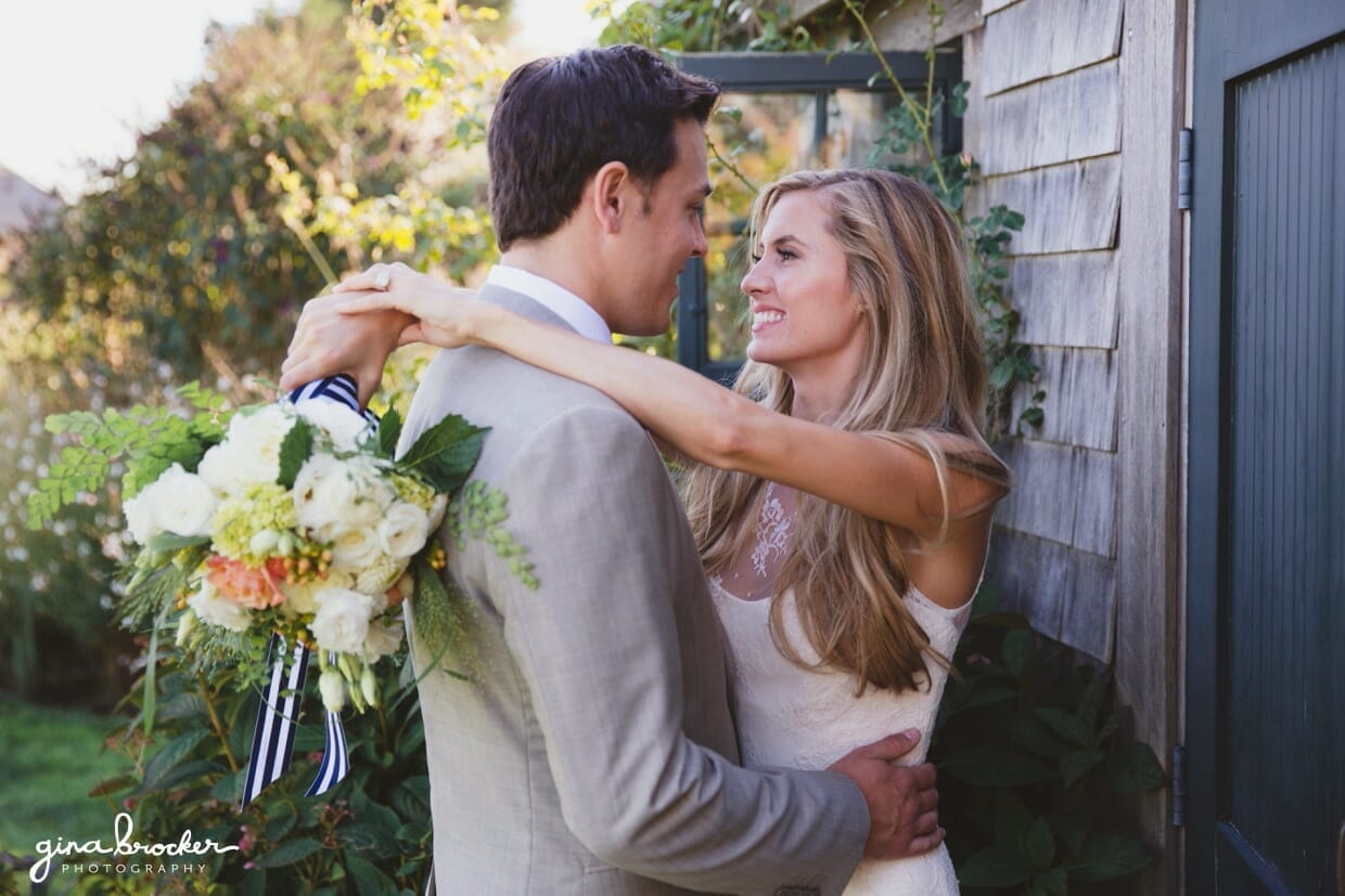 A sweet portrait of a bride and groom with a nautical inspired bouquet during their Nantucket Wedding at the Westmoor Club