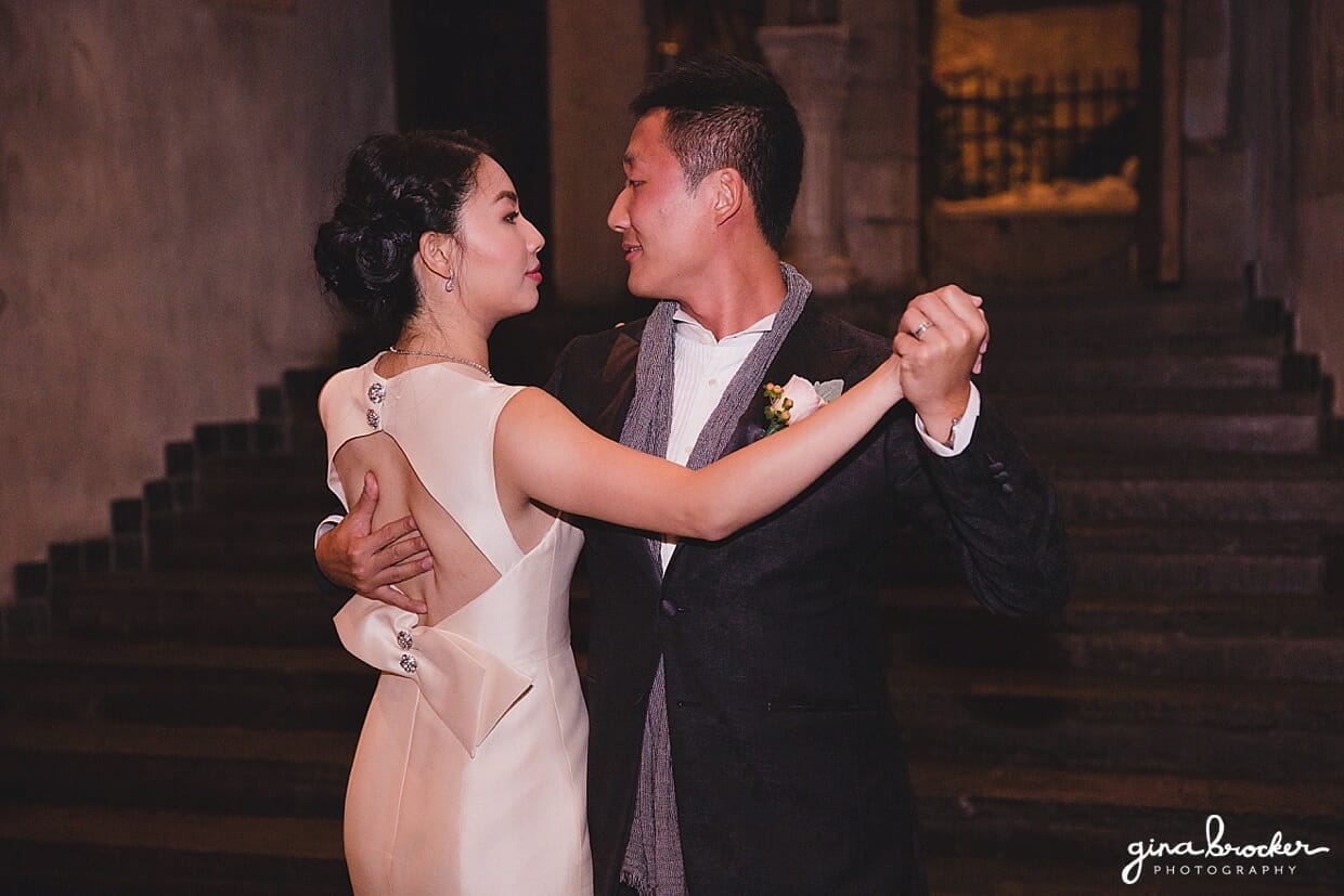 A newly wed couple share a first dance during their Hammond Castle Wedding in Gloucester, Massachusetts