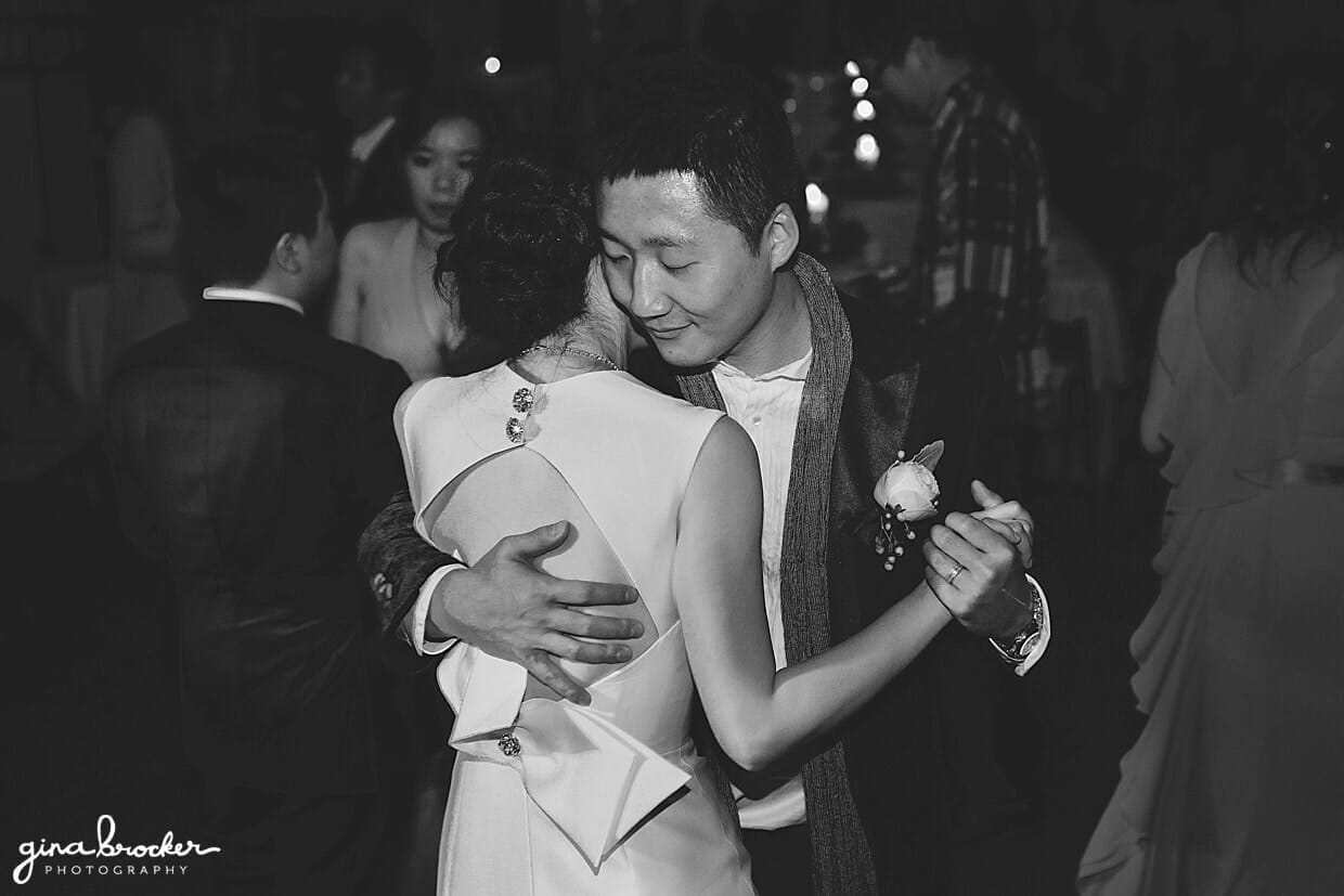 A sweet photograph of a couple hugging and dancing during their Hammond Castle Wedding in Gloucester, Massachusetts